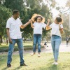 a family standing in a park